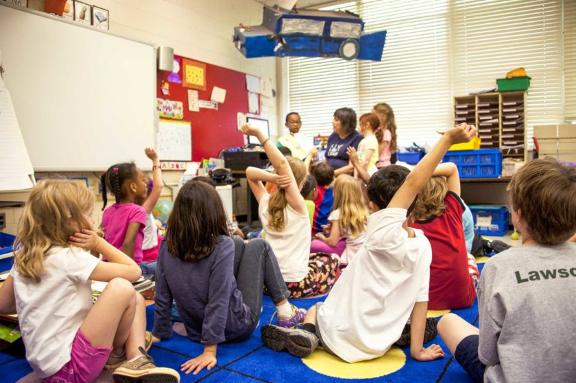 A group of young kids engaging in story time.