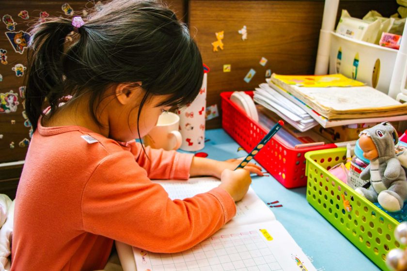 Little girl working on an assignment.