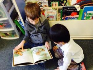 Two children reading together.