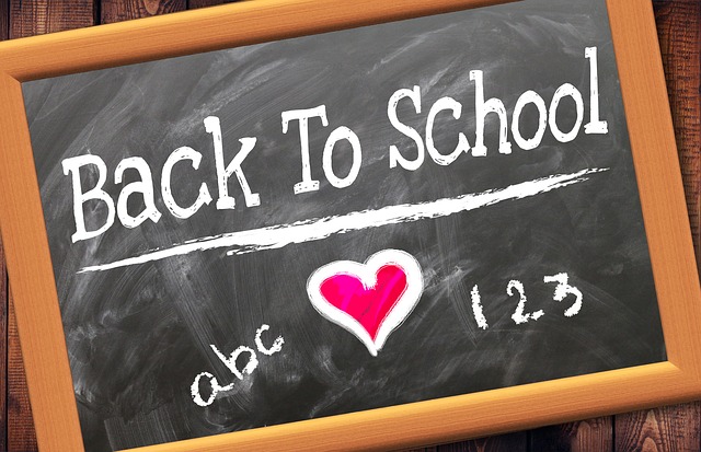 A chalkboard with the words back to school on it.
