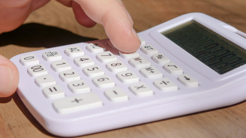 A child using a calculator.