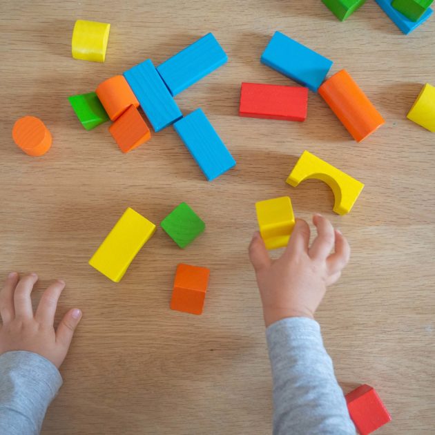 A child playing with colorful blocks.