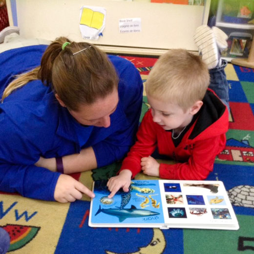 A child reading with an adult.