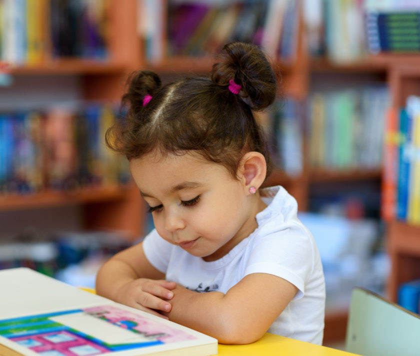 Little girl reading.
